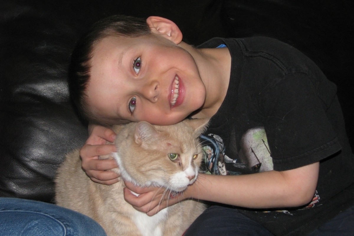 My son Jonathan holding our cat Simba