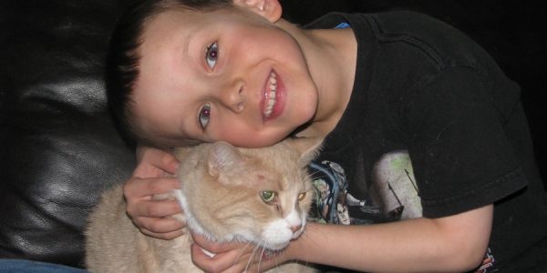 My son Jonathan holding our cat Simba